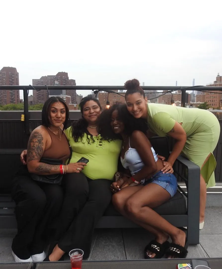 Group photo on the rooftop with city skyline